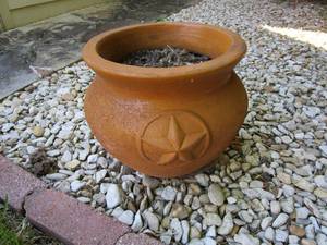 lot 99 image: 3 LARGE TERRACOTTA PLANT HOLDERS, 1 IS DIFFERENT STYLE &amp HAS A STAR ON THE FRONT
