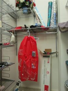 lot 136 image: DELUXE XMAS TREE, XMAS WRAPPING PAPER SOME UNOPENED, GIFT BAGS, BOWS HANGING ORGANIZER, 4TH OF JULY FLOWERS WITH FLAGS