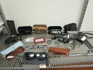 lot 144 image: LARGE LOT OF SUNGLASSES &amp EYEGLASSES, SOME W CASES, RAY BAN X-RAYS, AND A FEW MORE DESIGNER GLASSES, CANON POWER SHOT A410 W CASE
