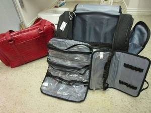 lot 139 image: TRAVEL BAGSCARRY ON, BLACK BAG HAS MULTIPLE COMPARTMENTS FOR ORGANIZATION &amp WHEELS, RED OVERSIZED PURSE