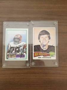 lot 194 image: 1975 Topps Ken Anderson and 1983 Topps Anthony Munoz football cards both have been autographed (Authenticity Unknown)