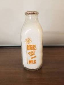 lot 10 image: Rogers Really Farm - Fulton, New York -  Fresh glass quart milk bottle with lid