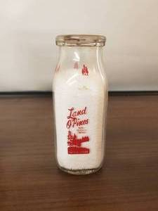 lot 12 image: Land OPines Dairy Products Co. - Lufkin, Texas- half pint glass milk bottle with lid
