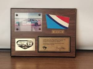 lot 24 image: 1992 Appreciation Tour piece of Richard Pettys car from that year on plaque