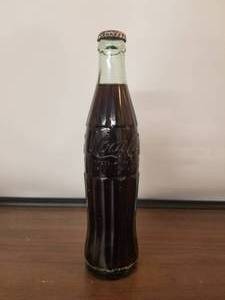 lot 25 image: Believed to be 1962 unopened Coke Coca Cola bottle