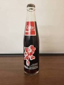 lot 51 image: 1986 University of Louisville National Champions Coke Bottle