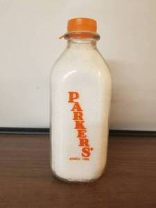 lot 52 image: Parkers Dairy - Nichols, Conn.- glass quart milk bottle with lid