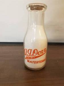 lot 58 image: A. G. Dorr Dairy - Watertown, New York -  pint glass milk bottle with lid