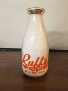 lot 64 image: Ruffs Dairy -St. Clair Michigan- quart glass milk bottle with lid