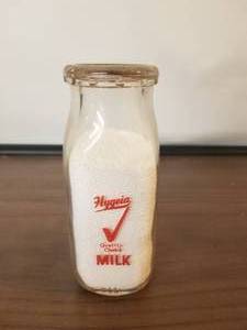 lot 65 image: Hygeia half pint glass milk bottle with lid