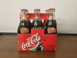 lot 71 image: 2002 NCAA baseball champions Texas Longhorns 6 pack coke bottles
