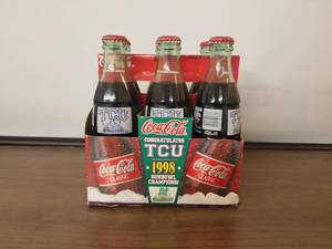 lot 72 image: 1998 Sunbowl Champions TCU 6 pack of coke bottles