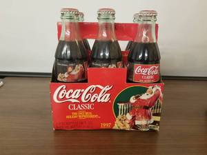 lot 76 image: 1997 ChristmasSanta Claus 6 pack coke bottles