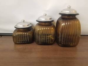 lot 111 image: Brown glass canisters with metal tops - set of 3