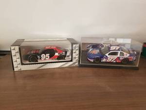 lot 138 image: Nascar 124 diecast racecars - #95 Mighty Auto Parts, $97 Texas Special