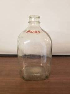 lot 147 image: Borden glass gallon milk bottle
