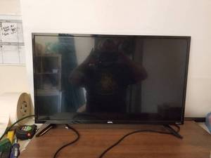 lot 226 image: ONN Roku TV with remote