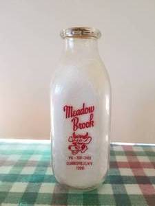 lot 36 image: Meadow Brook Farms - Clarksville, New York quart glass milk bottle with lid