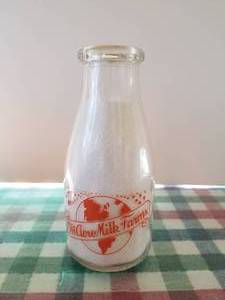 lot 37 image: Hi Acre milk farms - pint glass milk bottle with lid