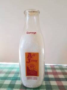 lot 64 image: Gamage Farms -Augusta, Maine quart glass milk bottle with lid