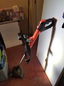 lot 99 image: Black and Decker 20 volt battery weed eater -