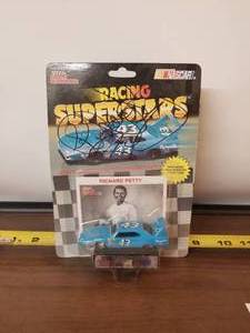lot 133 image: Richard Petty signed - Racing Champion 164 #43 diecast car - authenticity unknown