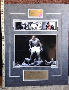 lot 192 image: LEGENDARY MUHAMMAD ALI COMMEMORATIVE WALL DISPLAY WITH METAL ETCHED PLATES - APPROX 13 X 20