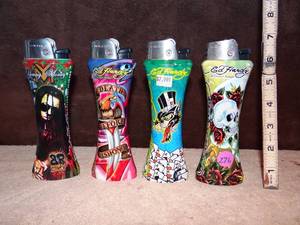 lot 276 image: LARGE ED HARDY 6 LIGHTERS WITH BOTTLE OPENER ON BOTTOM (X4)