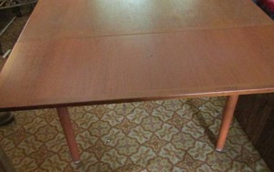 lot 11 image: Danish Dining Table slide out leaves,  top flips for games. 59x33 with leaves and 33x33 without
