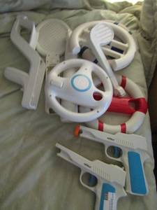 lot 32 image: Remotes for Wii, remote covers, remote holders