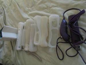 lot 33 image: Remotes for Wii, remote covers, remote holders