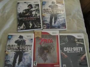 lot 34 image: Wii games- Medal of honor, call of duty, Zelda and 2 other call of duty