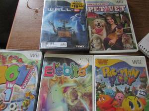 lot 36 image: Wii games- Pet Vet, Wall E, Pac man party, Elebites, 101 in 1