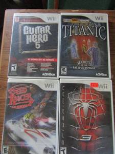 lot 37 image: Wii Games- Speed Racer, spider man, Guitar hero #5, Titanic Secrets of the fateful Voyage
