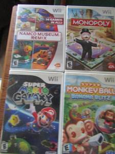 lot 39 image: Wii games- Mario Cart Super Galaxy, Monkey ball, Monopoly, Namco Museum Remix