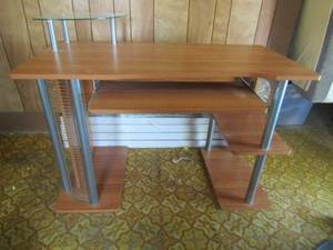 lot 56 image: Blonde wood computer desk 30x27x24 with slide out tray for keyboard, 2 shelves and glass corner piece for monitor