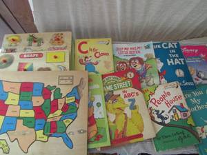 lot 73 image: Dr. Seuss books, Mercer Mayer books, Sesame Street Books and 3 wooden puzzles
