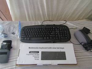 lot 75 image: 3 black Onn wired key boards, 1 computer speaker by dell and 2 COMPUTOR Cameras