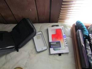 lot 86 image: Ladies coin purses, 11pro max phone case,  1 phone  and phone case