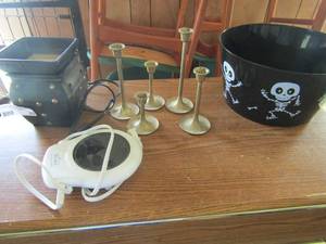 lot 89 image: Rival beverage warmer, Halloween candy bucket, wax melt, and 5 brass candle holders
