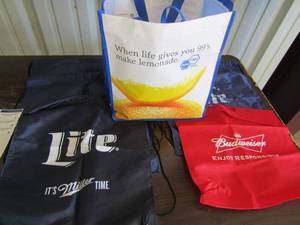 lot 23 image: Bag full of miller and Bud draw string bags