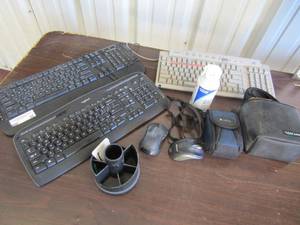 lot 38 image: Logitech and Sony keyboards, small pen caddy, 2 wireless mousse, 2 empty camera bags