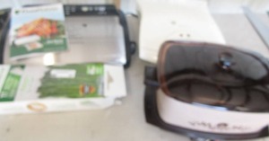 lot 45 image: Brown Westbend multi purpose cooker (knob on lid broken) Food saver comes with bags and instructions Belgian waffle maker