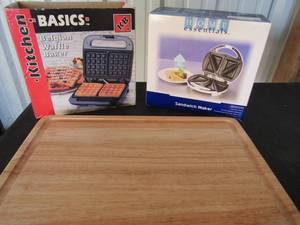 lot 52 image: Basics Belgian waffle maker, Home essentials sandwich maker and large cutting board