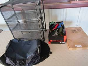 lot 53 image: Clear view Garment bag NIB , 3 drawer rolling cart, box full of can cozies