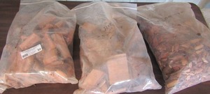 lot 60 image: 3 bags wood chunks and chips in apple, hickory and mesquite