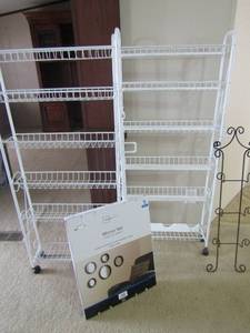 lot 69 image: 38x10 wall hanger for decorative plates, 2 white rolling storage shelves 56x25 with 6 baskets on each 5 piece mainstay mirror set