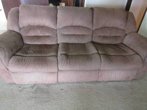 lot 82 image: Full size brown sofa with reclining ends, matching love seat reclines with broken spring ( replacement available on Amazon $18.98
