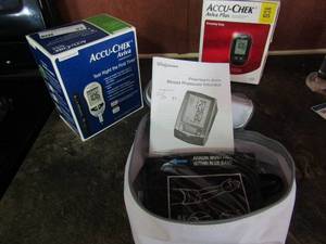 lot 87 image: BP monitor, Acu check blood sugar tester x 2