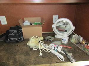 lot 92 image: Makeup mirror, blow-dryer, hair products, back brace